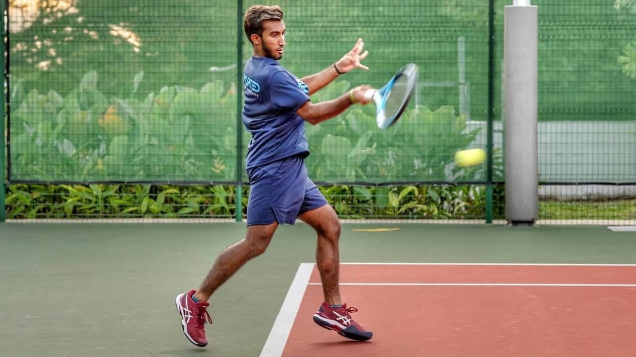 Shaheed Alam displaying his forehand prowess as he receives a ball in mid-flight.
