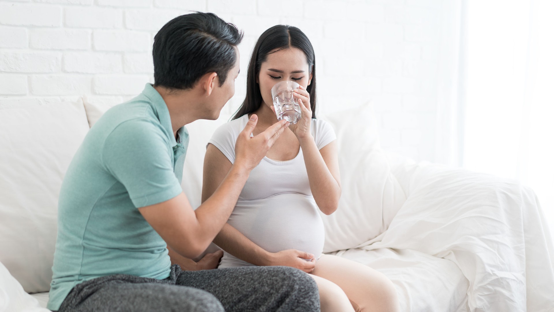 Pregnant wife and supportive partner during her pregnancy journey.