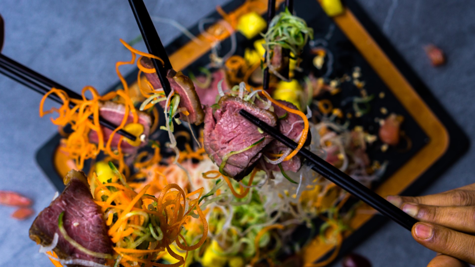 Beef slices and symbolic fruit liven up this yu-sheng from Brazilian-style steakhouse Picanhas.