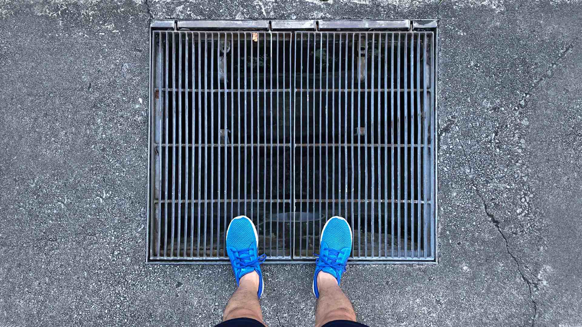 Grilled gratings like this one allow for surface run-off to prevent ponding after it rains, and are structurally safe for runners and cyclists.