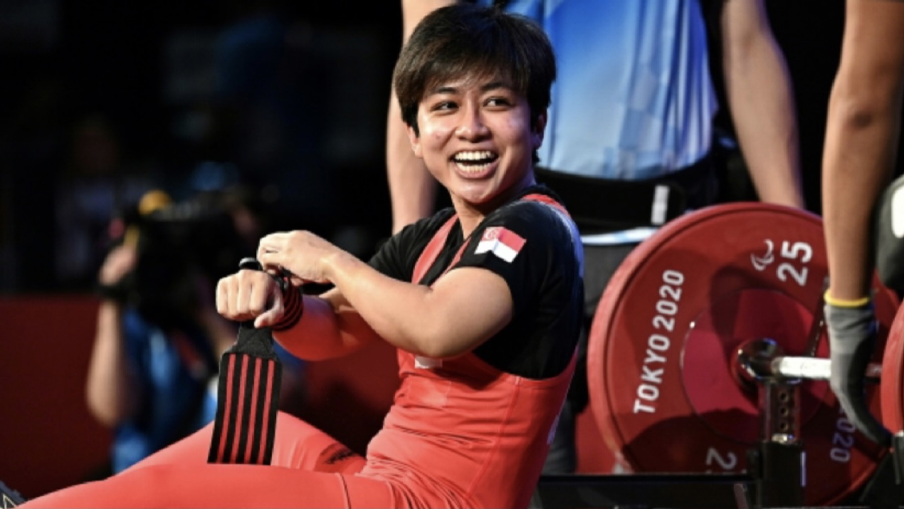 Para-powerlifter Nur 'Aini showcases true grit at the Tokyo 2020 Paralympics, inspiring others with her strength, spirit, and dedication to the sport.
