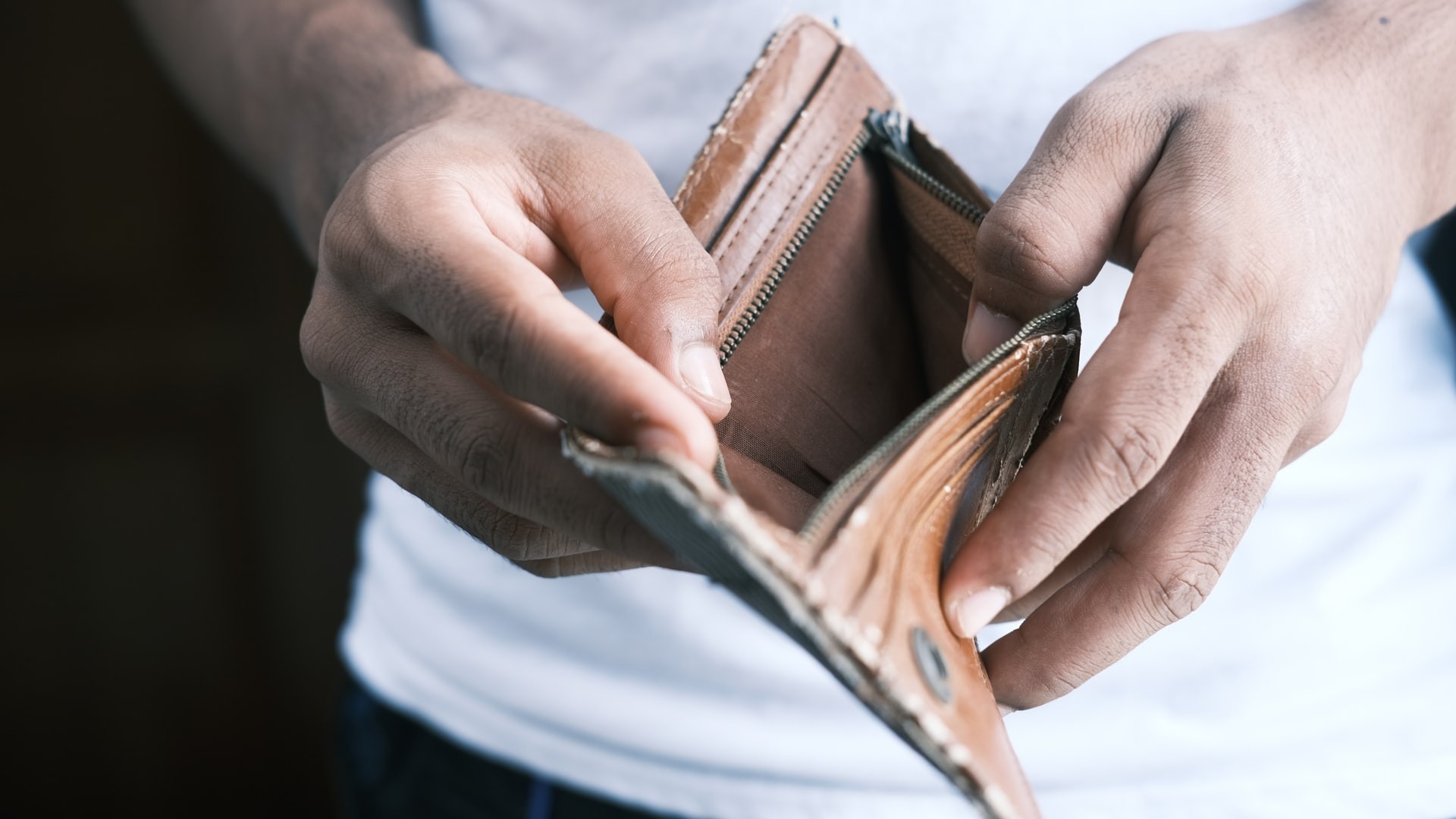 Unhealthy spending habits to break, from impulse shopping and retail therapy to poor budgeting, social spending, and buying low-quality essentials.