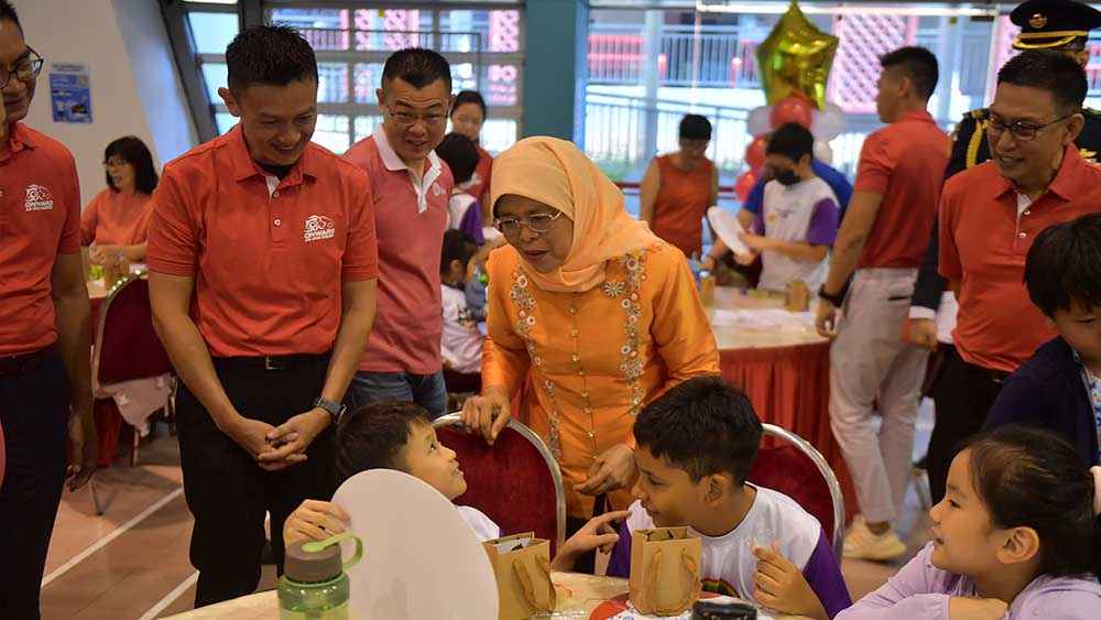 President Halimah Yacob meets young beneficiaries at the launch of the NDP 2023 Give As One SG Campaign, a movement encouraging Singaporeans to volunteer.