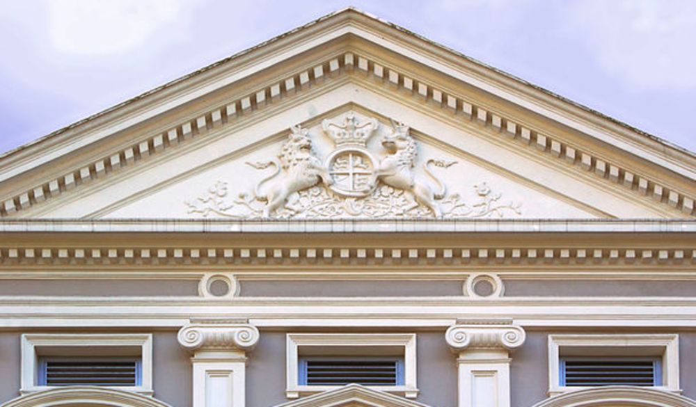 Royal Coat of Arms of the United Kingdom located on a pediment of the National Museum of Singapore.