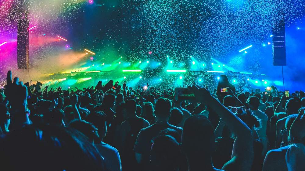 Concert etiquette tips: how to sing, dance, and post responsibly while respecting fellow concertgoers and the venue.
