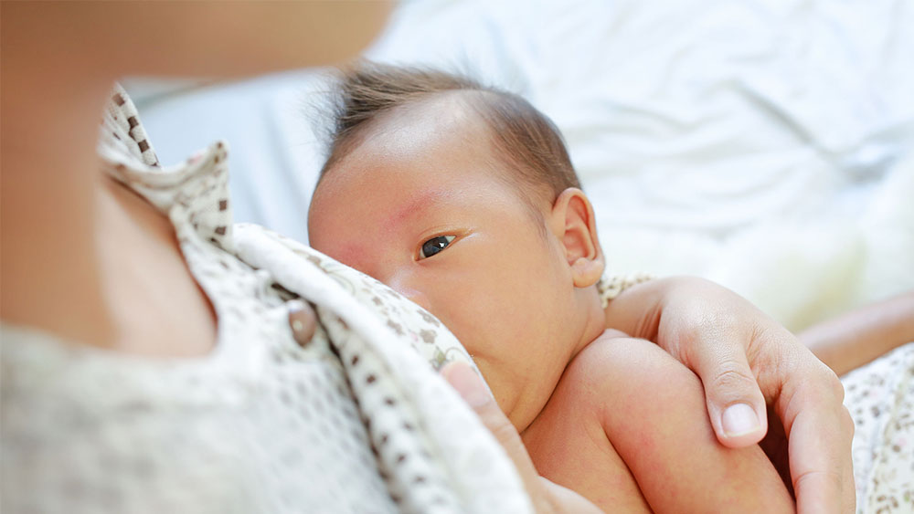 Breastfeeding, baby feeding on breast milk
