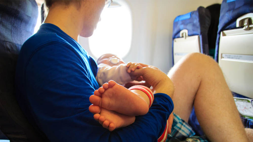 Here's how to fly on a budget airline with a baby, without going insane.