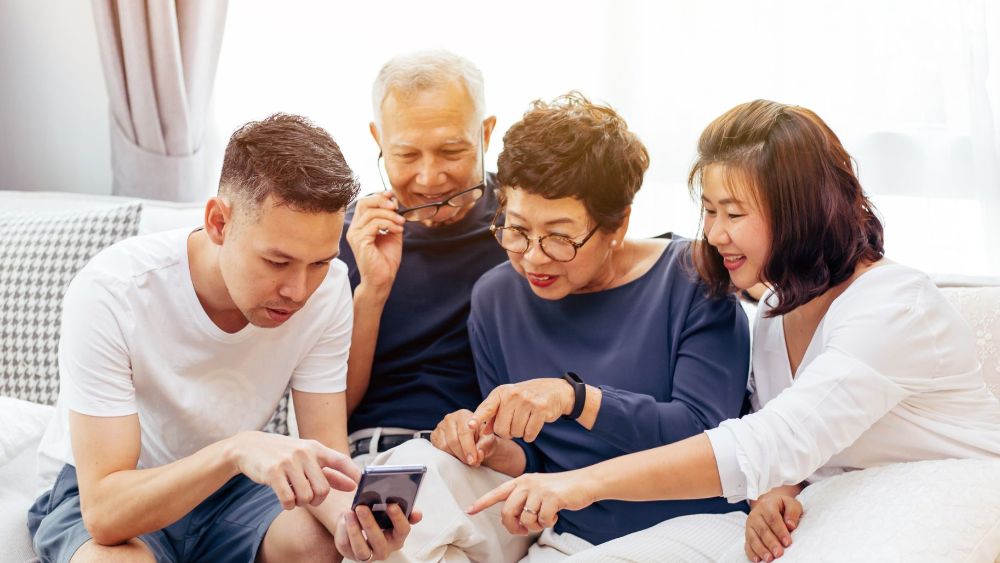 A newlywed seeks advice from two seasoned colleagues on handling guest lists, family expectations, and in-law dynamics while planning a wedding.