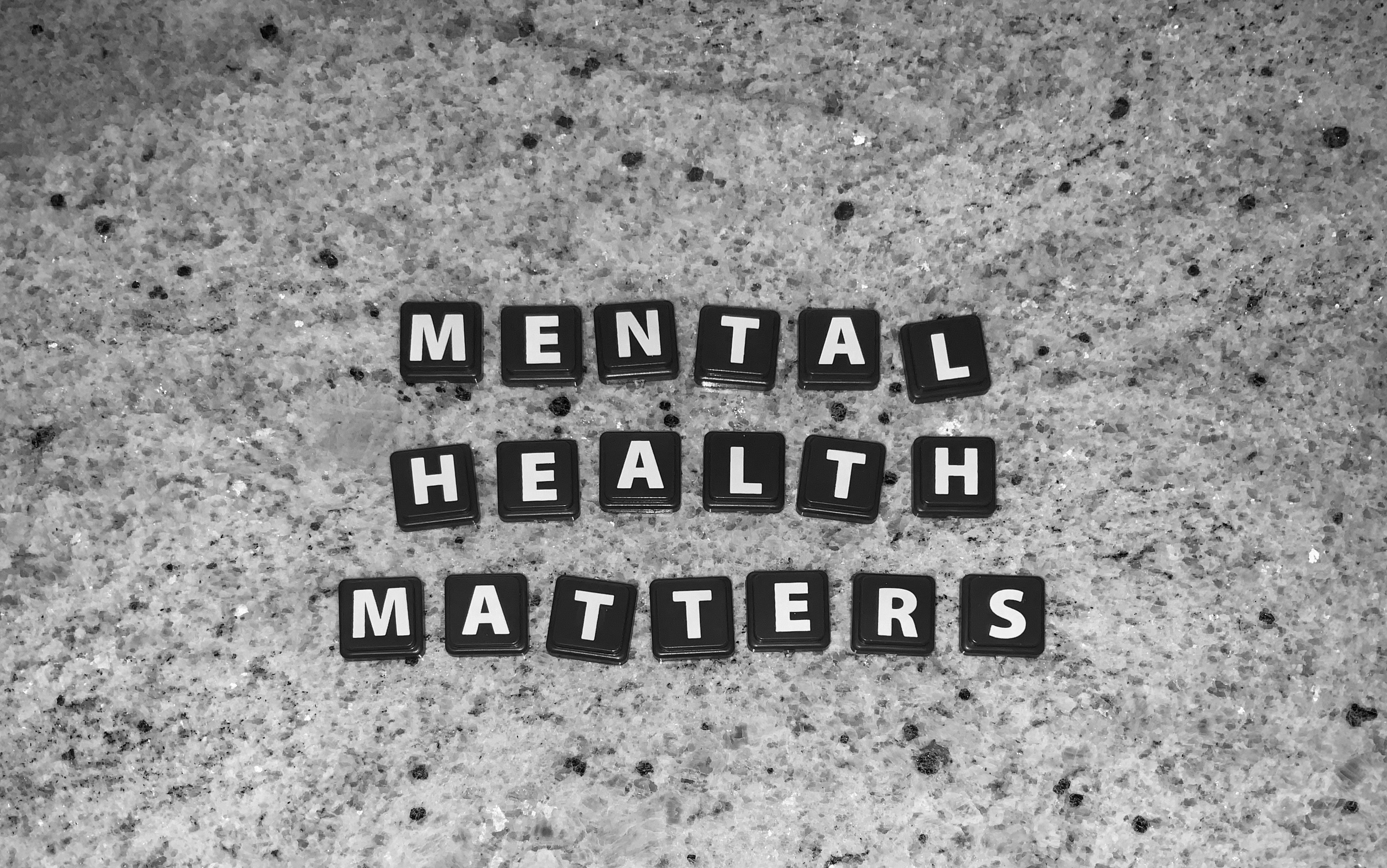 Abstract art showing mental health matters on tiles